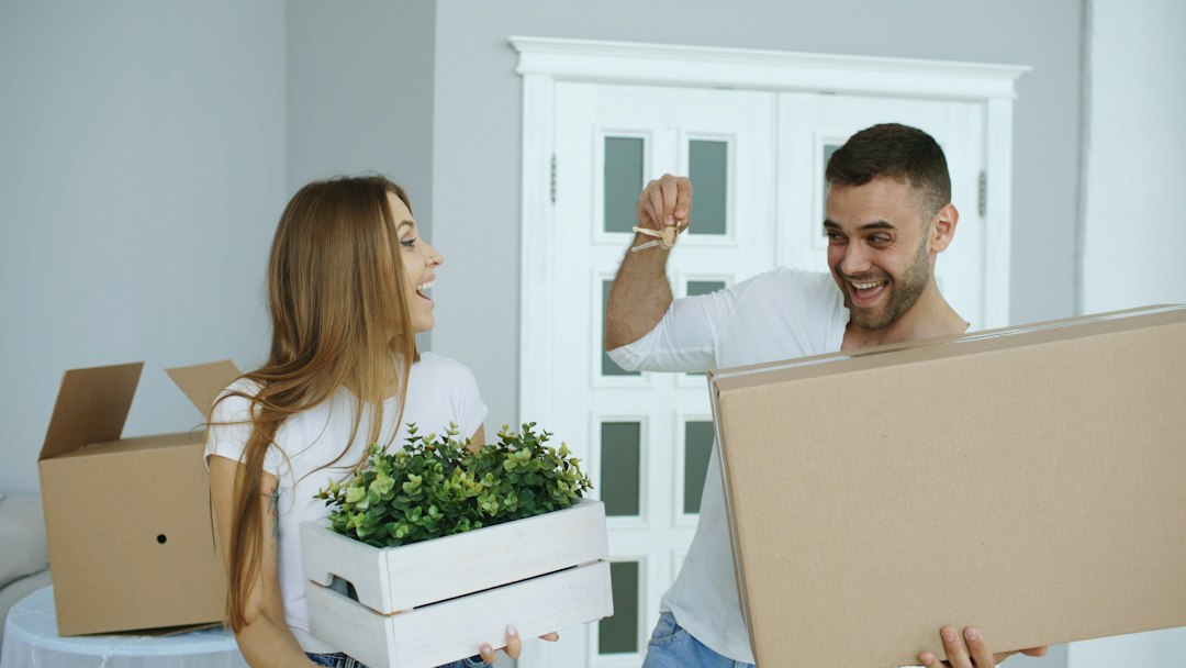 Homebuyers receiving the keys to a new home